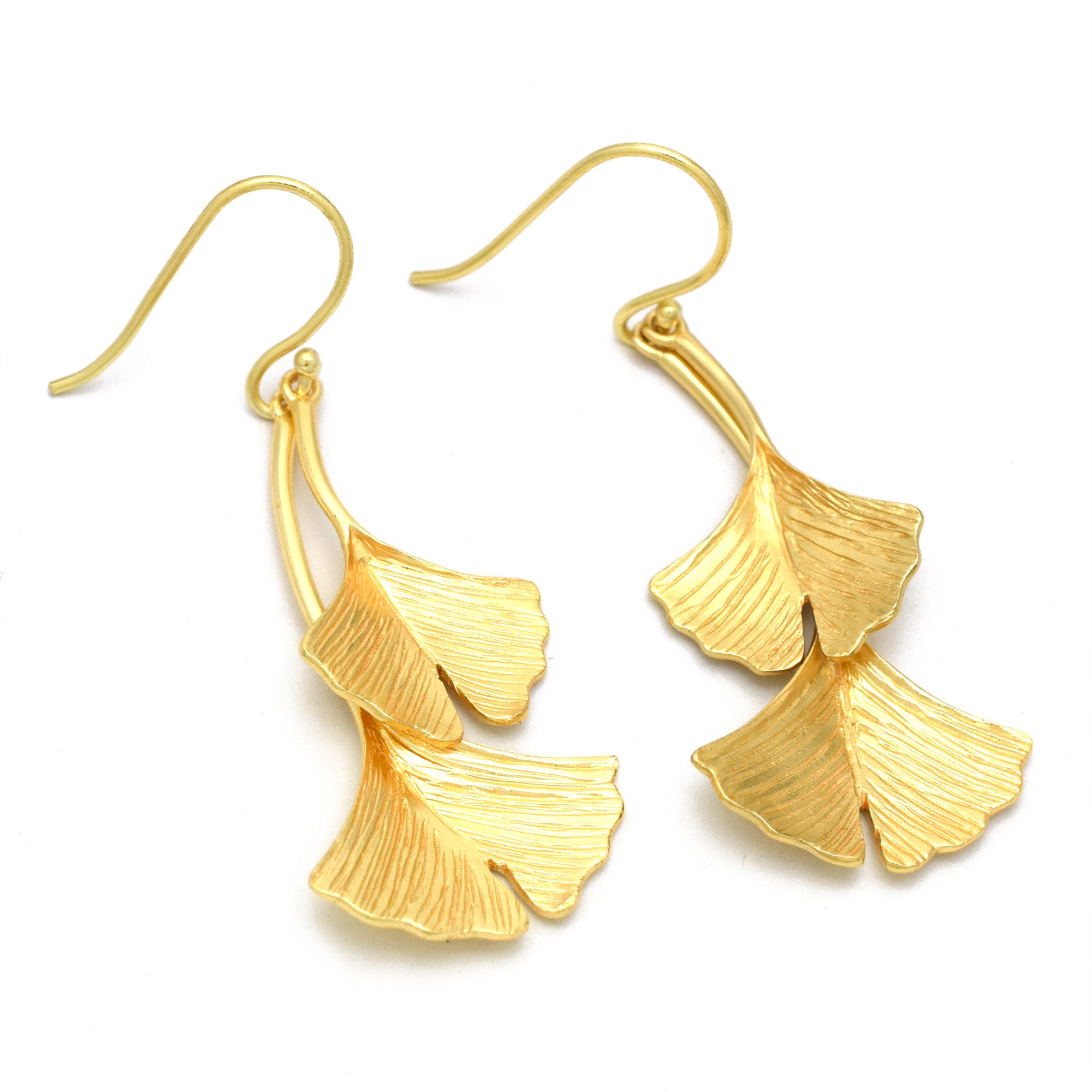Earring with a temple tree leaf pendant