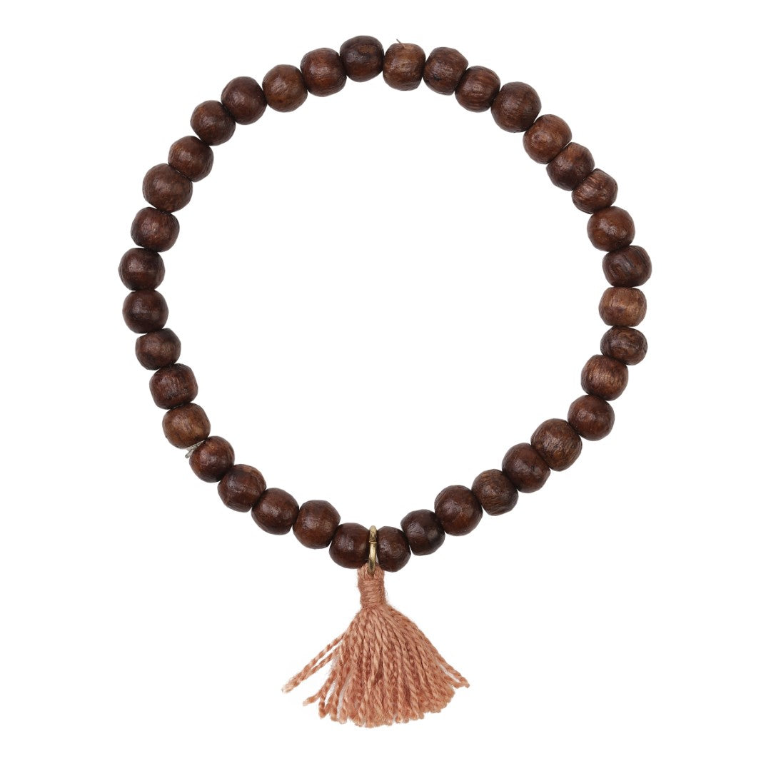 Bracelet with wooden beads of mango wood clay tassel